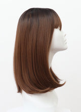 A synthetic wig on a mannequin head featuring a brunette/copper long bob with fringe.