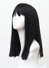 A mannequin head showcasing a long natural black wig with fringe.