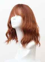 A mannequin head displaying a dark ginger wig with natural waves and a fringe.