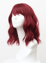 Plum colored wig with natural wave and fringe on a mannequin head.