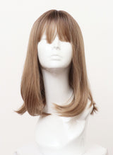 A synthetic dirty blonde shoulder-length wig with flicked tips and fringe displayed on a mannequin head.