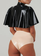 Back view of a black latex cape, worn with peach latex knickers.