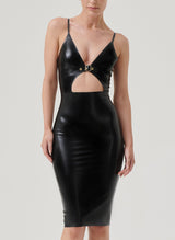 A model wearing a black latex pencil dress with a front cutout and gold buckle detail, with adjustable shoulder straps.