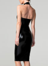 Back shot of a model wearing a black latex pencil dress with a wide halter neck collar and a low back, fastened with press studs.