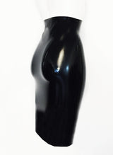 Back view of a black latex pencil skirt on a white background.
