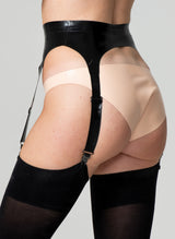 Back view of a person wearing a black latex suspender belt with four adjustable straps, paired with pale peach latex hipster briefs and black stockings.