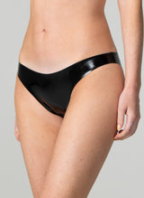 A person wearing black latex rubber briefs with a low-rise waist.