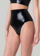 Close up shot of a model wearing black latex high-waisted knickers.