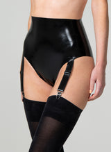 A person wearing high-waisted black latex knickers with four adjustable suspender straps. Worn with black stockings. The image shows the person from the waist down, focusing on the garment.