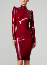 A model wearing a skintight, plum latex knee-length dress with long sleeves, and high collar. The dress features pleated sleeve heads and undersbust seam with bust-gathers.