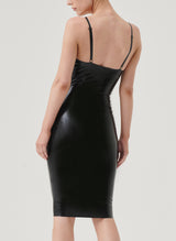 Back view of a model wearing a black latex pencil dress with adjustable shoulder straps.