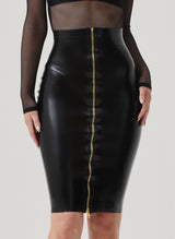 A high waisted black latex pencil skirt with a gold front zip, paired with a fishnet top.