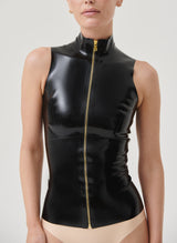 A model wears a sleeveless black latex top with gold zip and high collar.