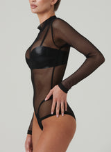 A black fishnet bodysuit with long sleeves and a high neck. Worn over black latex bra and G-string.